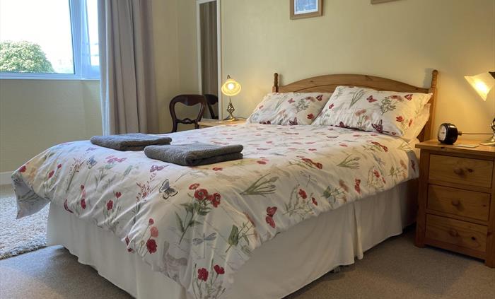 Spacious downstairs master bedroom with rear aspect and view of the garden